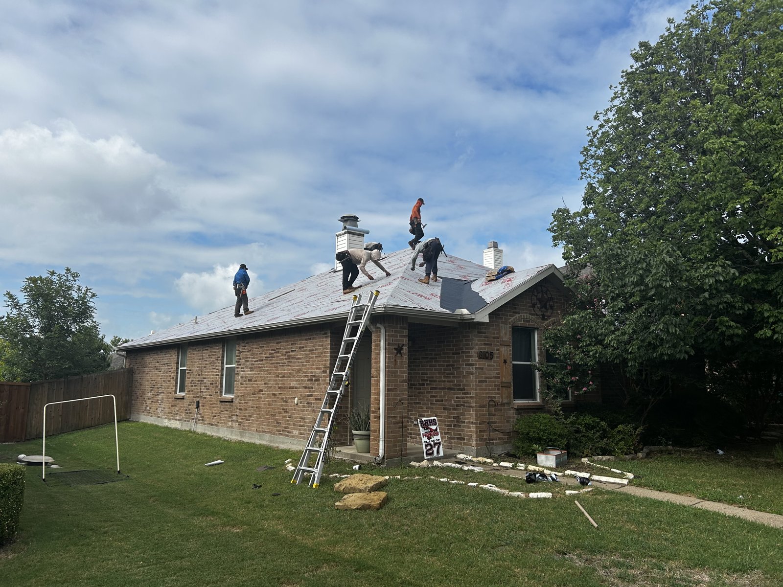 McKee Roofing crew working on a home roof in Rockwall, TX
